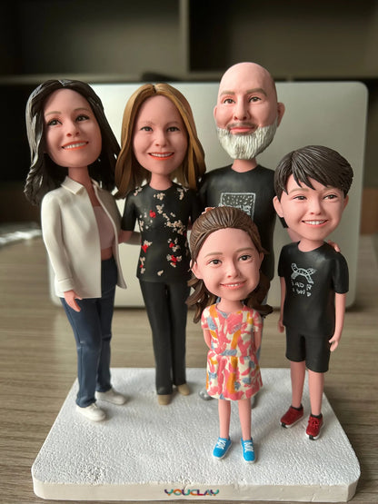 Close-up of a family of five: bearded grandpa, two women, a girl in a pink dress and a boy in black
