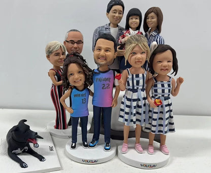 Ten family members on three round bases with a black dog lying beside them, custom bobbleheads