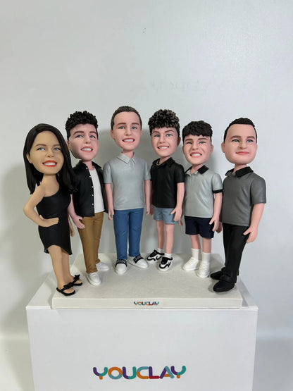 Woman in a black dress beside five young men in polos and tees, a set of 6 figurines